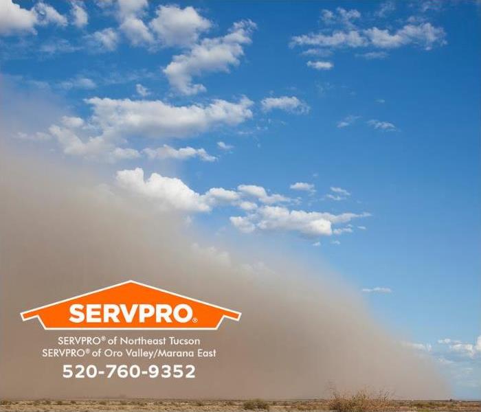 A dust storm in the Arizona desert is shown.